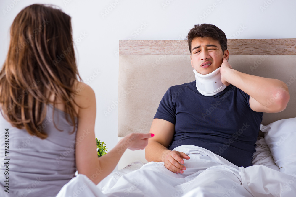 Loving wife taking care of injured husband in bed Loving wife taking care of injured husband in bed