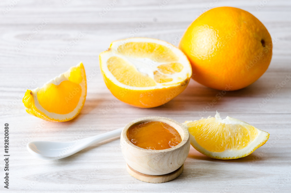 Orange jam served in spoon on the table Orange jam served in spoon on the table