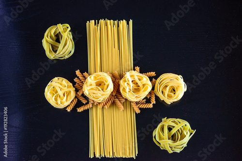 Geometry with spaghetti, tagliatelle, noodles and fussilli photo