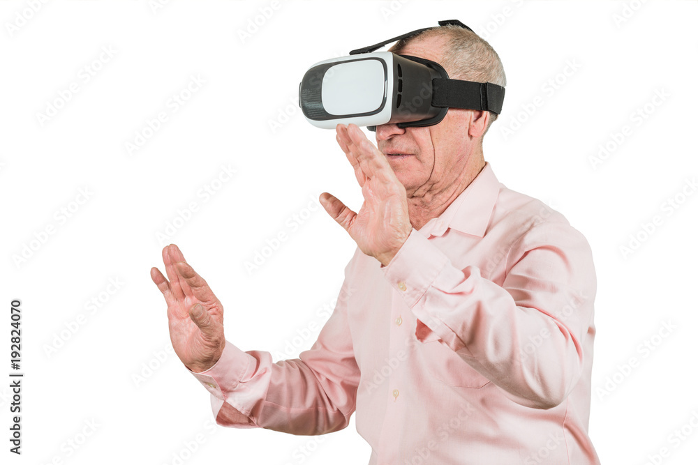 Grandfather is looking at the VR sunglasses, gestures with his hands, isolated on a white background. Grandfather is looking at the VR sunglasses, gestures with his hands, isolated on a white background.