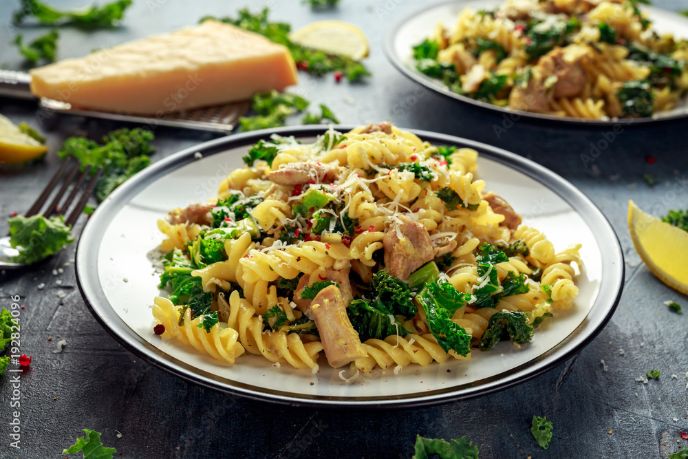 Homemade Pasta fusilli with Chicken, Green Kale, Garlic, lemon and parmesan cheese. healthy home food Homemade Pasta fusilli with Chicken, Green Kale, Garlic, lemon and parmesan cheese. healthy home food