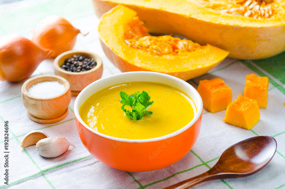 Pumpkin soup served on the table in bowl Pumpkin soup served on the table in bowl