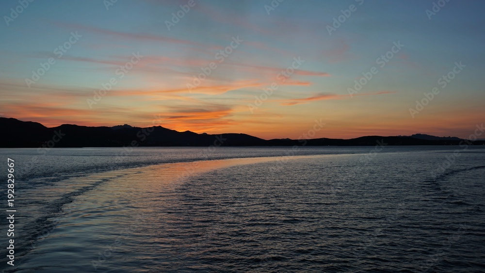 Goodbye Sardinia. After the departure from the port of Golfo Aranci sunset, Sardinia