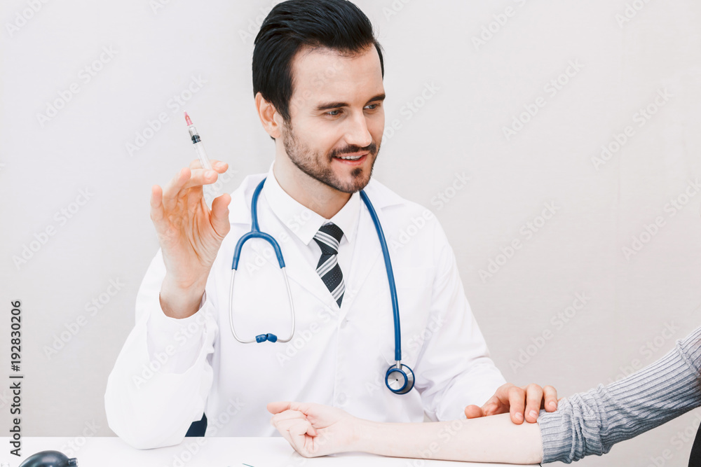 Doctor in protective gloves giving a female patient injection in hospital.healthcare and medicine Doctor in protective gloves giving a female patient injection in hospital.healthcare and medicine
