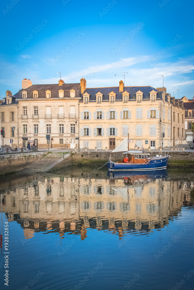 Houses and boats in the port of Vannes, magnificent city in Brittany 
