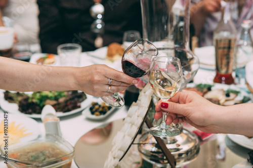 Red and white wine. Wine in glasses. Wedding table.