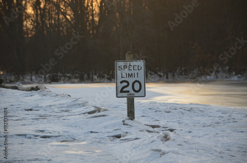 Fototapeta Naklejka Na Ścianę i Meble -  A 20 mph sign in ice jam