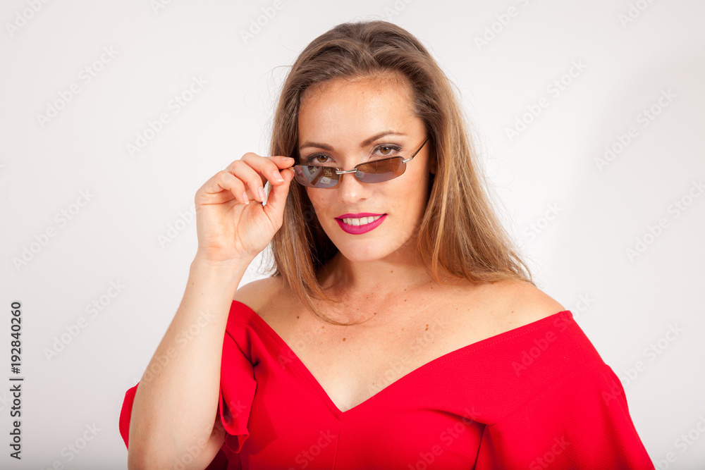 business lady looking over the edge of her sunglasses business lady looking over the edge of her sunglasses