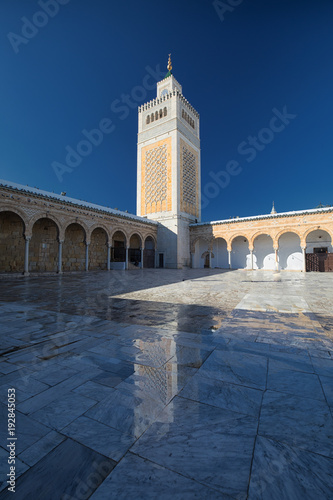 Minaret with a reflection