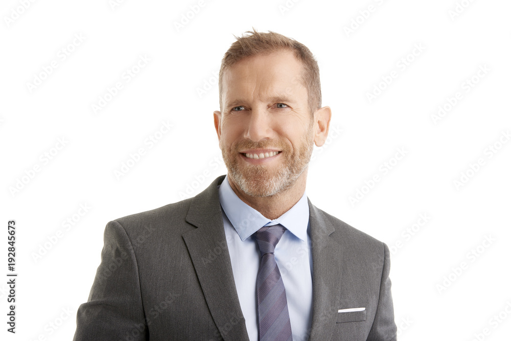 Senior businessman. Studio portrait of a middle aged man wearing suit and standing against at isolated white background. Senior businessman. Studio portrait of a middle aged man wearing suit and standing against at isolated white background.