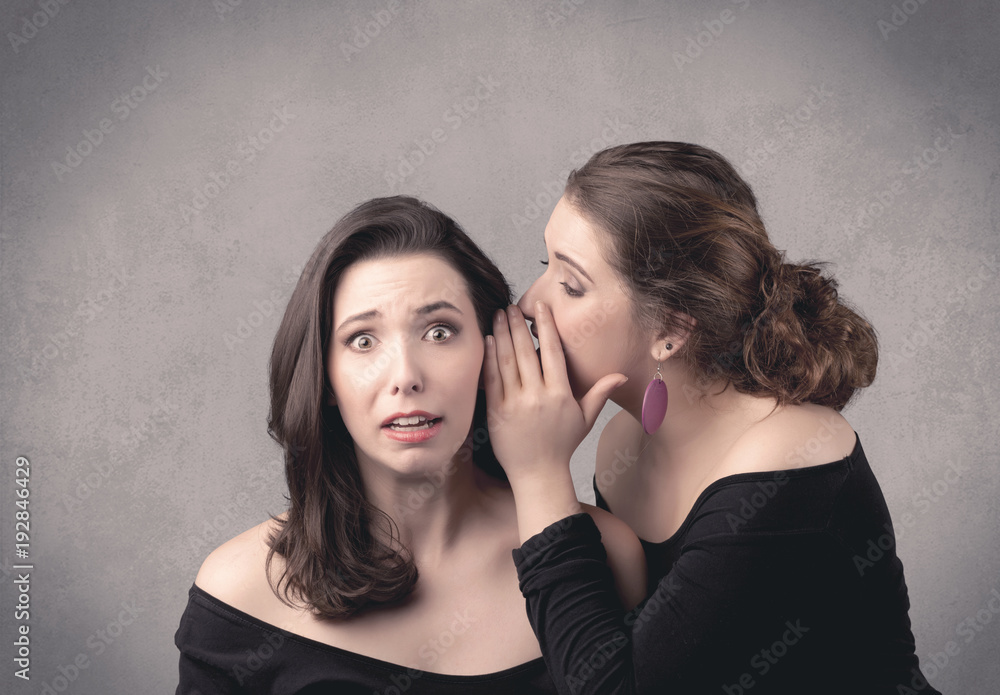 girl telling secret things to her girlfriend girl telling secret things to her girlfriend