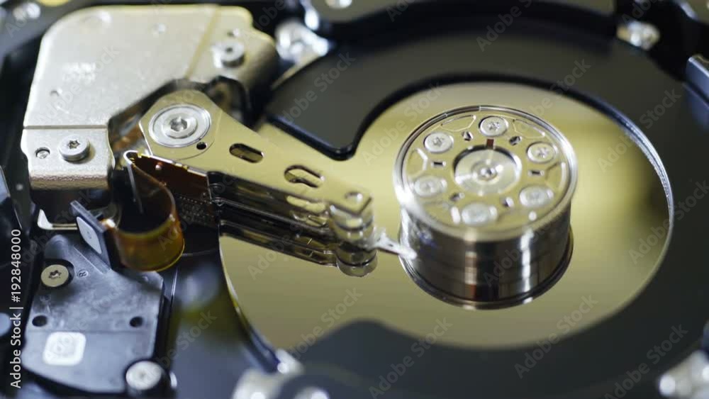 Closeup internals of SATA hard disk drive, shallow depth of field, sliding video Closeup internals of SATA hard disk drive, shallow depth of field, sliding video