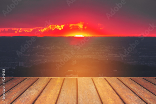 Empty wooden floor and sunset landscape view.