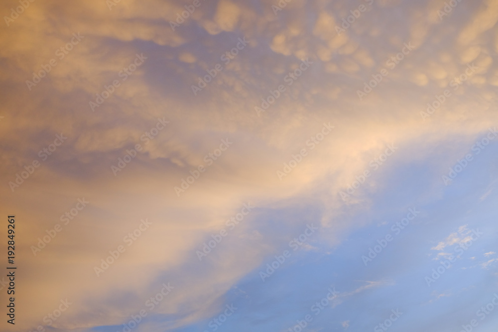 Fototapeta premium Orange clouds with blue sky sunset moment