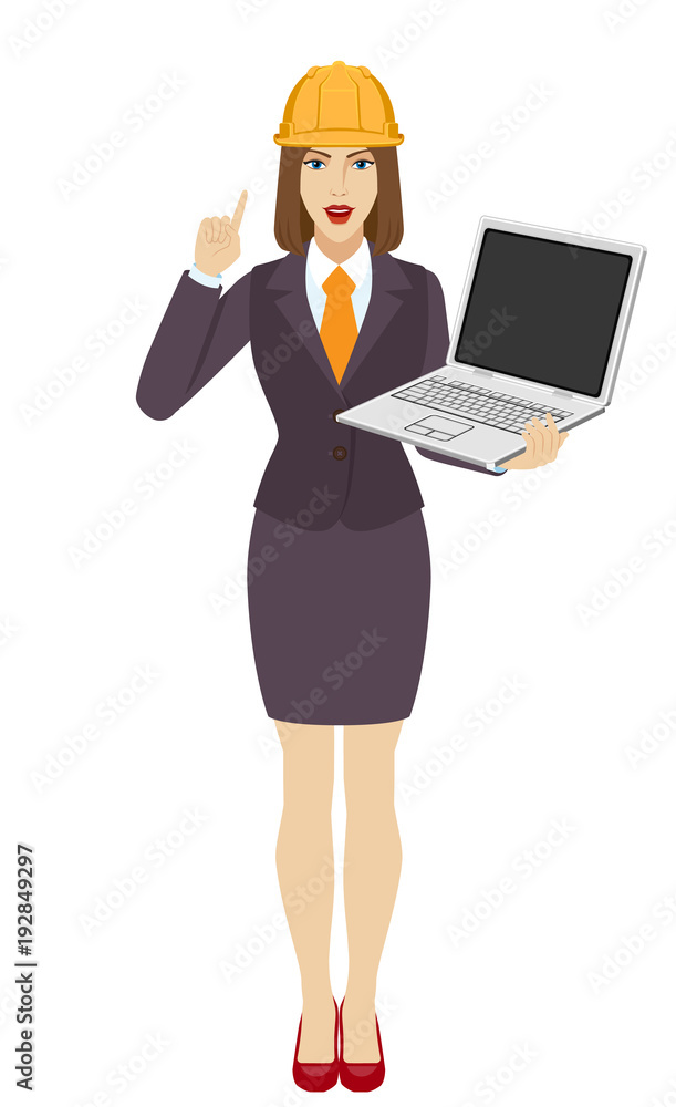 Businesswoman in construction helmet holding a laptop notebook and pointing up Businesswoman in construction helmet holding a laptop notebook and pointing up