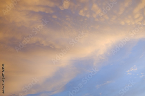 Orange clouds with blue sky sunset moment © khobenz