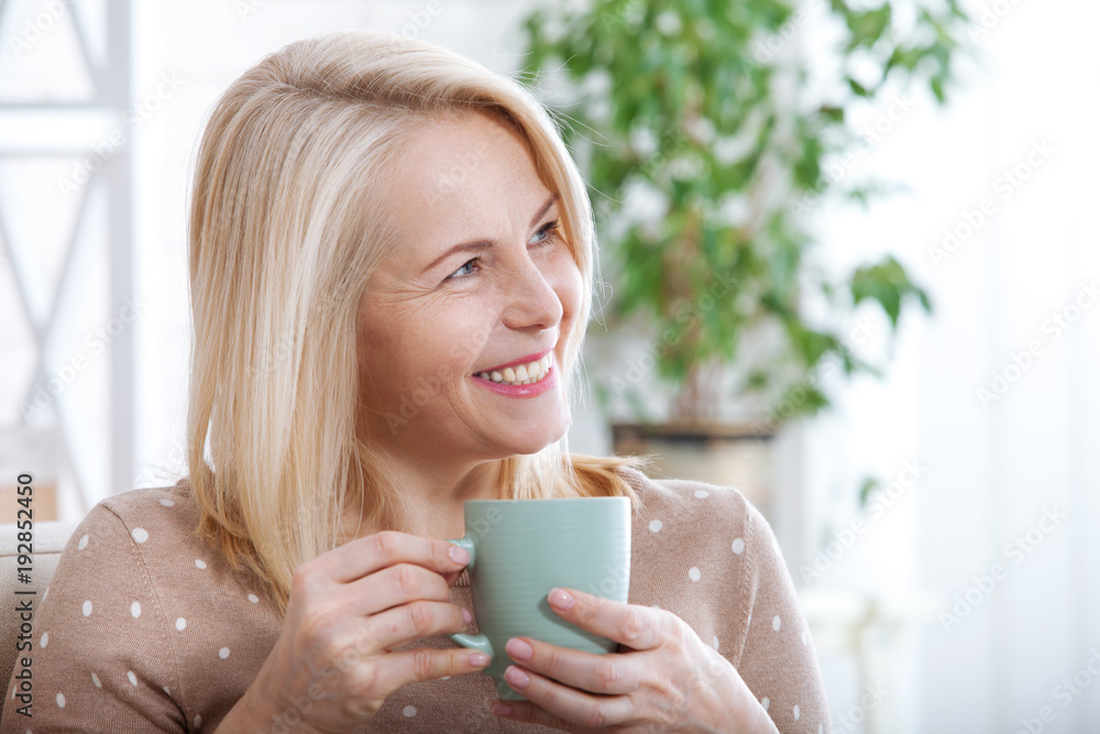 Portrait of happy brunette with mug in hands Portrait of happy brunette with mug in hands