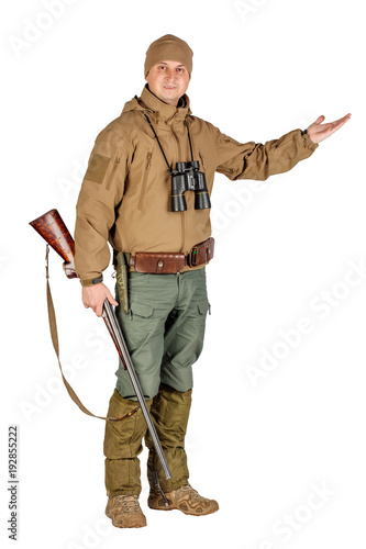 Full length portrait of a male hunter with double barreled shotgun Isolated on white background. hunting and people concept.