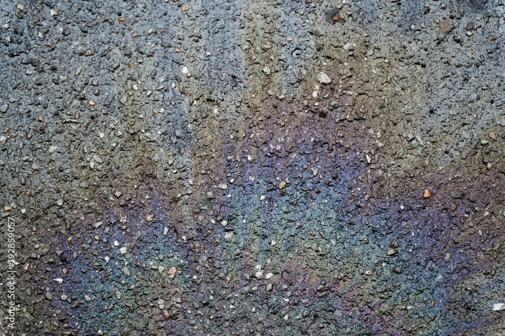 Oil spill on asphalt road, abstract background or texture foe web site or mobile devices Oil spill on asphalt road, abstract background or texture foe web site or mobile devices