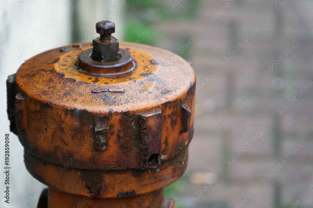 Fire Hydrant in the City street, detail prevention system with stone out of focus pavement background Fire Hydrant in the City street, detail prevention system with stone out of focus pavement background