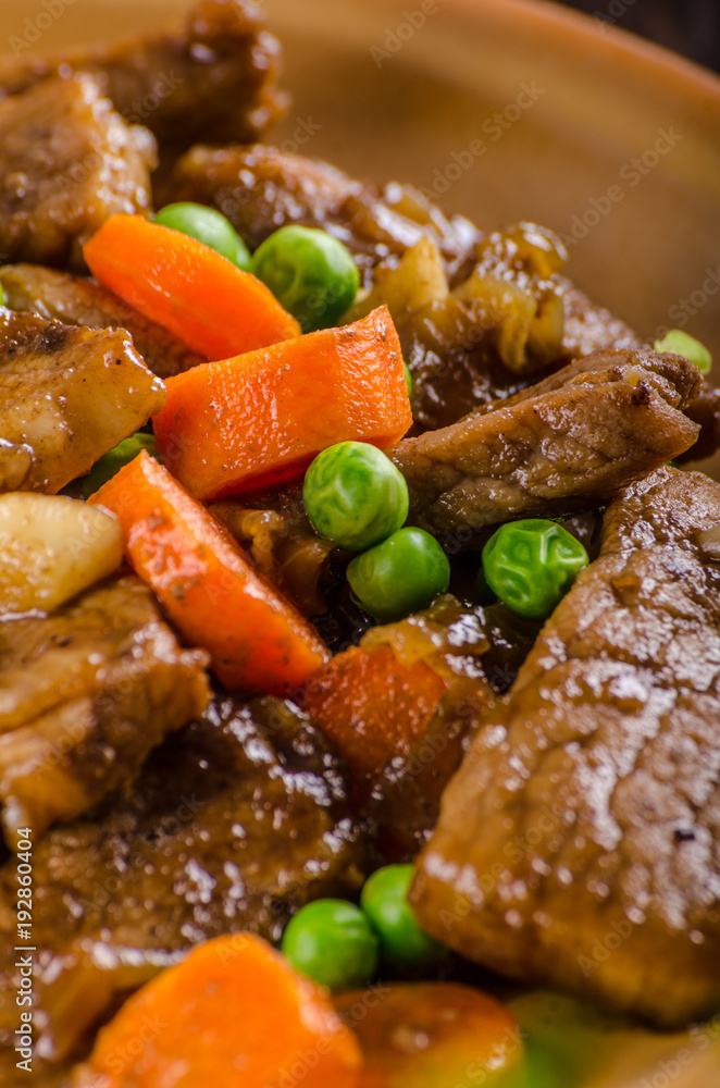 Pork medallions with vegetable and soy garlic sauce Pork medallions with vegetable and soy garlic sauce
