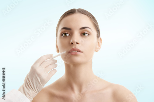 Young woman receiving cosmetic injection