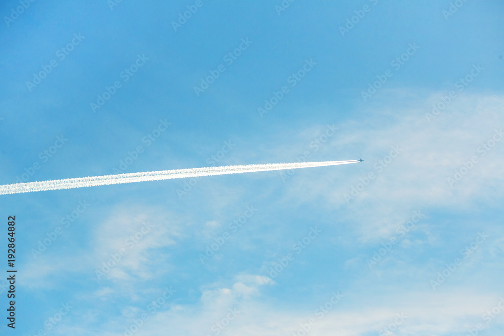airplane contrail against clear blue sky airplane contrail against clear blue sky