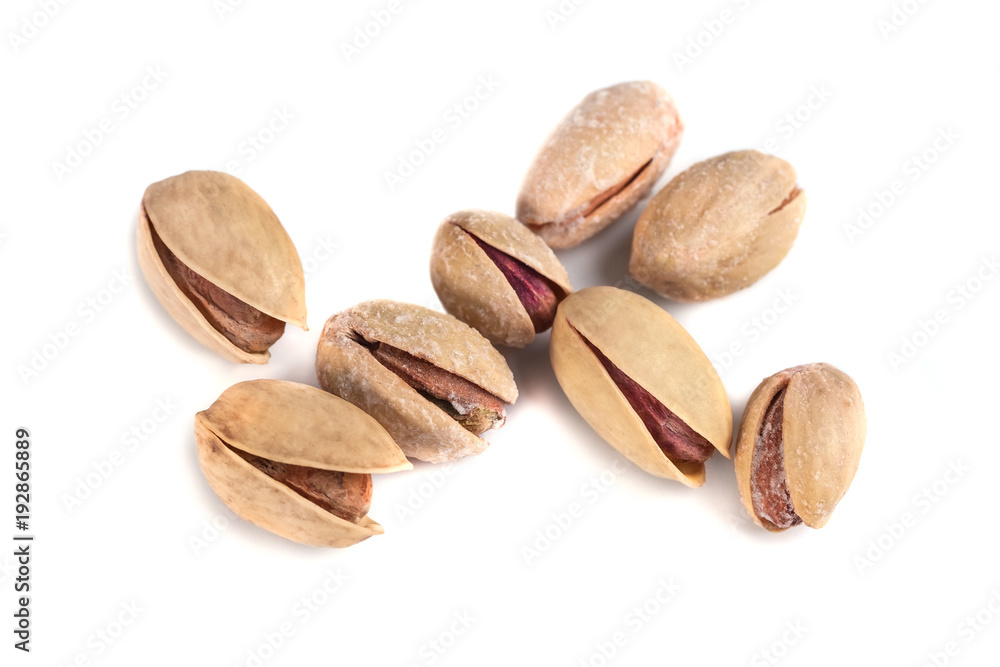 Heap of salted pistachio nuts isolated on a white background Heap of salted pistachio nuts isolated on a white background