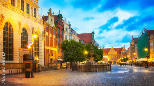 Beautifully illuminated Old Town in Gdansk with Neptune's statue. Poland, Pomerania.