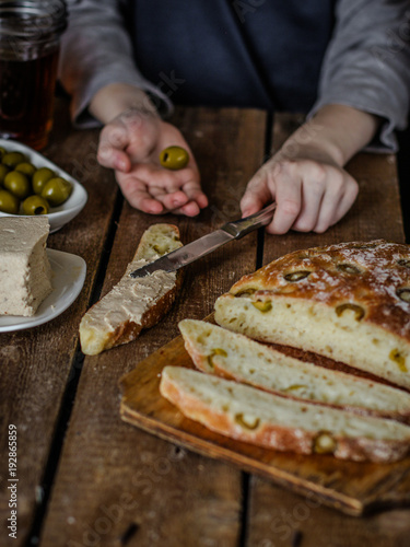 ciabatta - bread with olives on a wooden surface