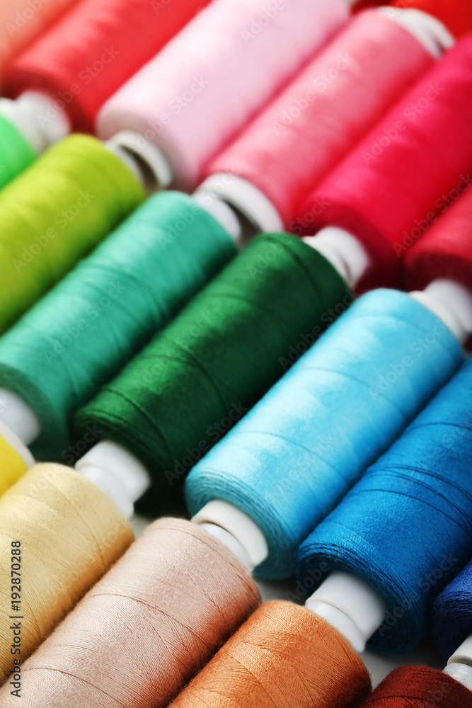 Background of colourful thread spools Background of colourful thread spools