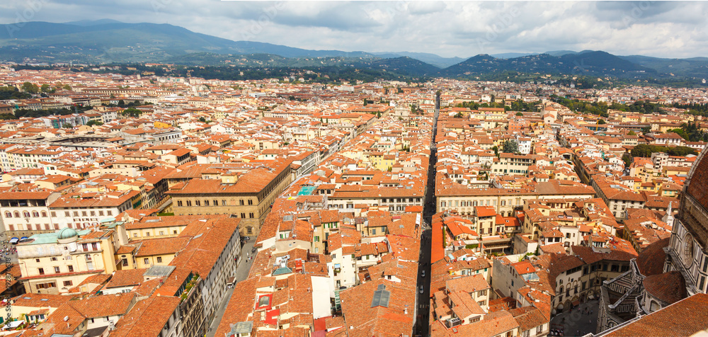 Cityscape from height, roofs of red tiles and narrow streets of Florence, Italy
