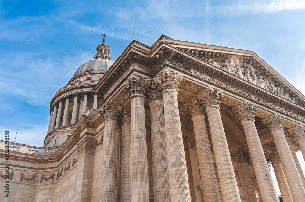 Low level view on Pantheon with its columns, front porch and dome in Paris. Former church, later mausoleum and burial place of distinguished French citizens.