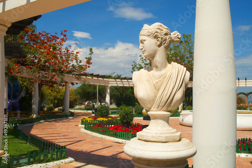 Decorative antique sculpture in artificial park