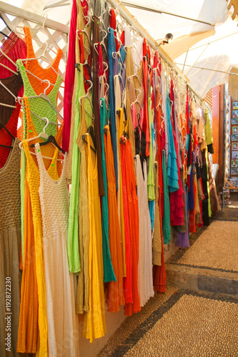 Colorful knitted dresses at the market