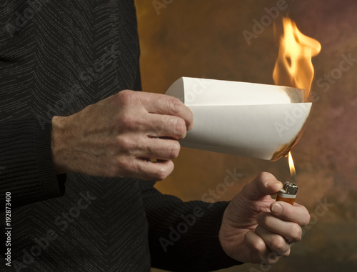 man burning document