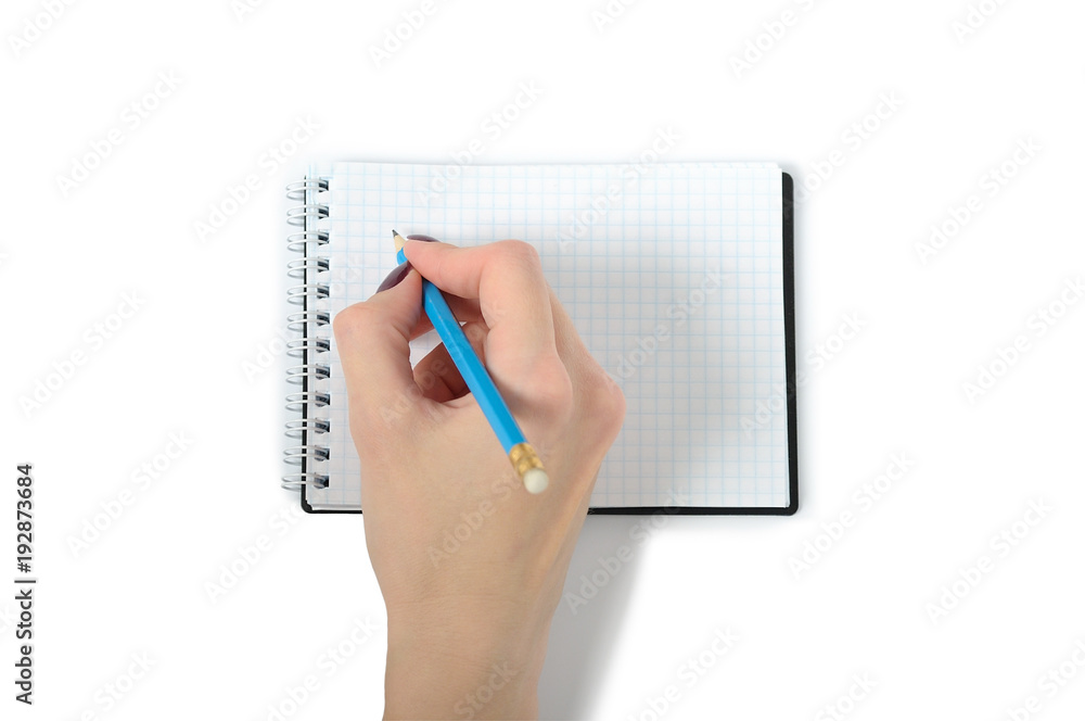 Female hand writing on notebook with white background. isolated Female hand writing on notebook with white background. isolated