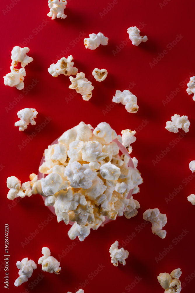Popcorn on a bright red background top view