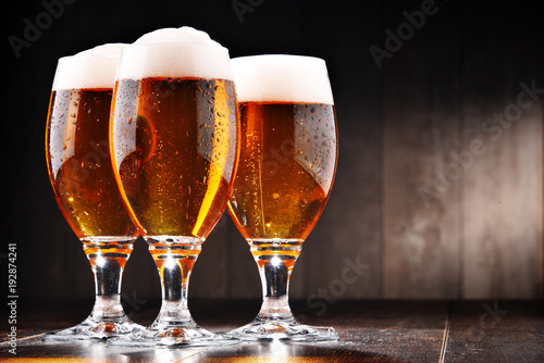 Composition with three glasses of lager beer