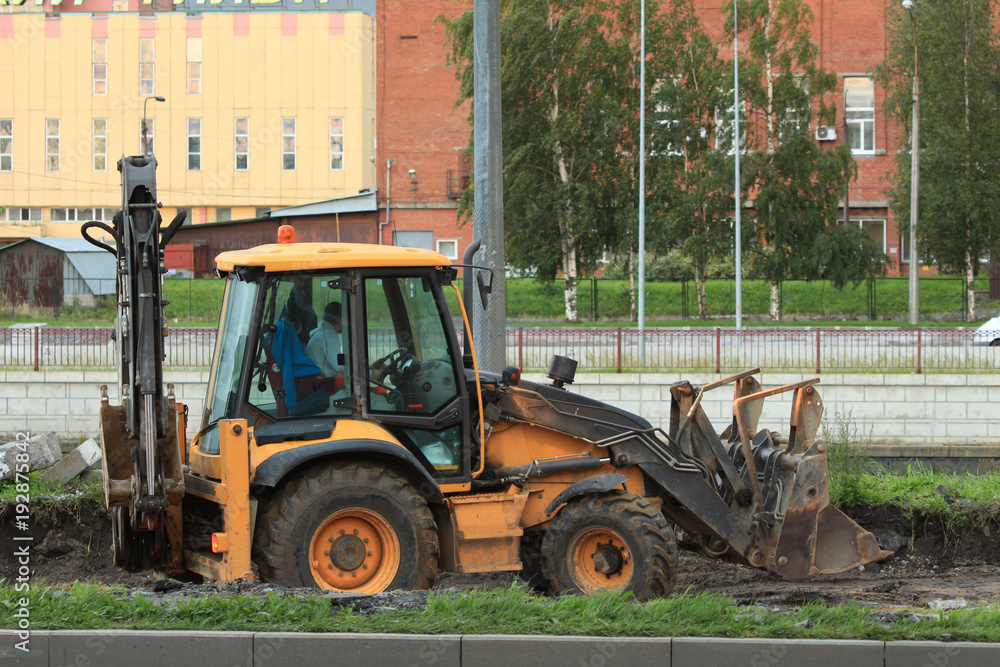 tractor with bucket on the street tractor with bucket on the street