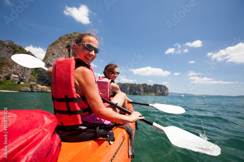 Canvas Print Women are kayaking in the open sea at the Krabi shore, Thailand