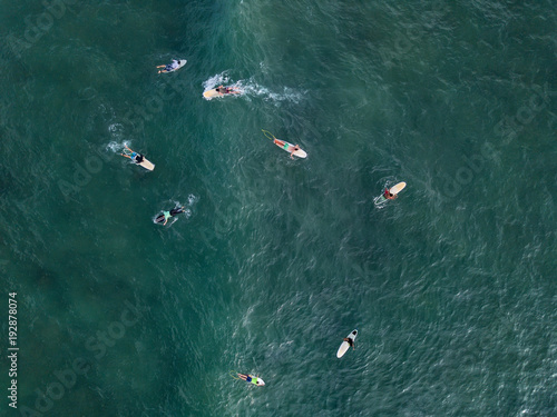 Aerial photo of surfers on boards