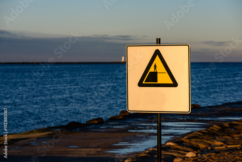 attention signs near sea with stormy weather