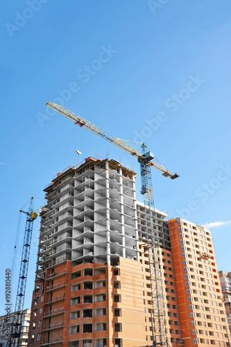 Crane and highrise construction site