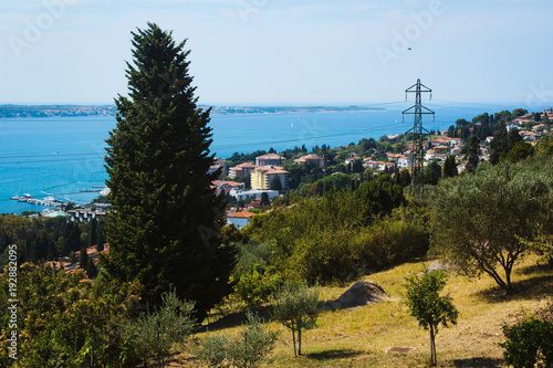 Panorama view of historical town Piran, city close to Portoroz, Slovenia, Europe during spring. Alps, Italy, with snow in the background