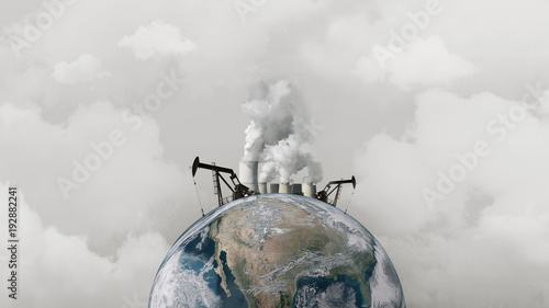 Fototapeta Naklejka Na Ścianę i Meble -  Concept pollution of the environment. Oil rigs and an atomic plant on the planet earth