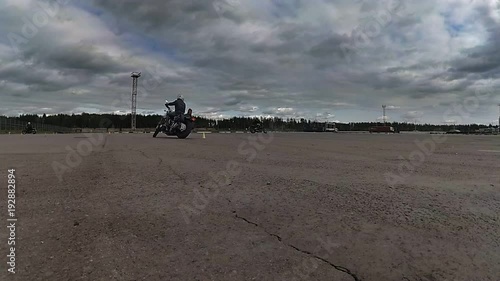 The rider slowly going around a traffic cone bike photo