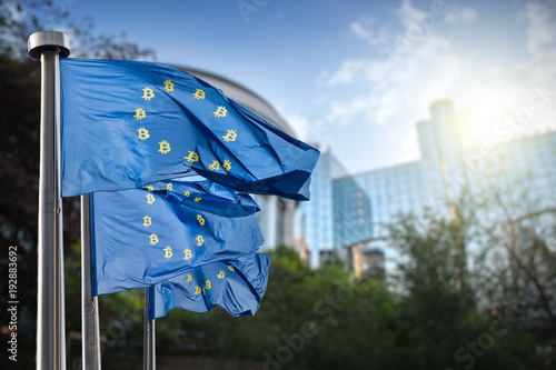 On the blue flag the symbol bitcoin. Regulation of the crypto currency by the European Union photo