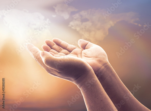 World environment day concept: Human open empty hand over blurred world map of clouds background
