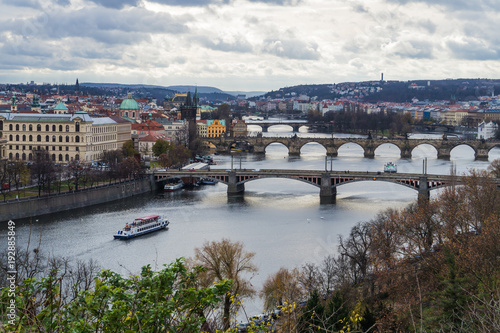 Panoramic view of Vltava river with boat and bridges. Concept of Europe travel, sightseeing and tourism.